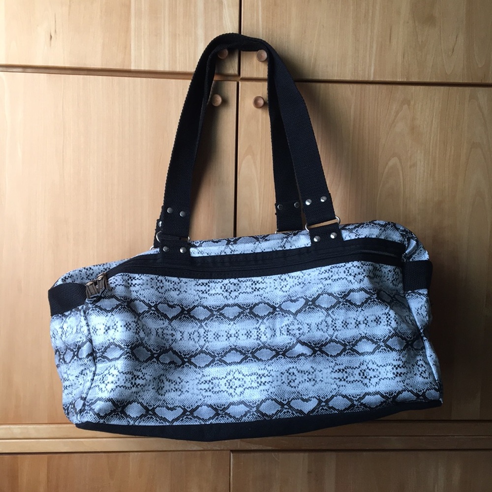 Black and white snakeskin print duffle bag